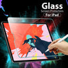 A hand writes on an iPad protected by a clear glass screen protector against a colorful, abstract background.