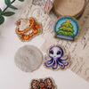A collection of ten faith-themed acrylic hairbows featuring various designs like a cake, Christmas tree, and octopus.