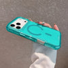 A hand holds a turquoise glitter finish shockproof magnetic case for an iPhone against a neutral background.