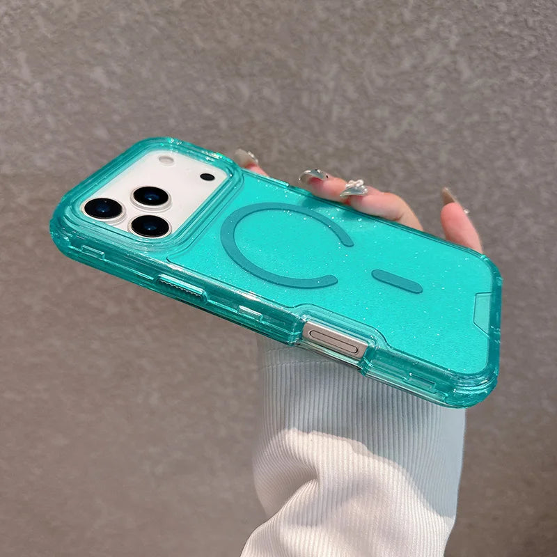 A hand holds a turquoise glitter finish shockproof magnetic case for an iPhone against a neutral background.