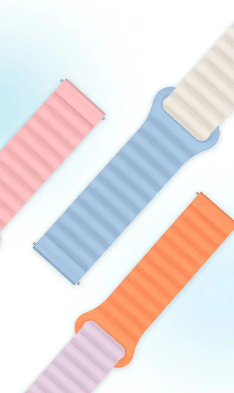 Three adjustable magnetic loop watch bands in pink, blue, and orange colors shown diagonally.