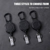 Three styles of black retractable key chains for ID cards and credit cards displayed on a dark surface.
