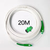 A coil of white single-mode fiber optic cable, labeled 20M, with green connectors visible.