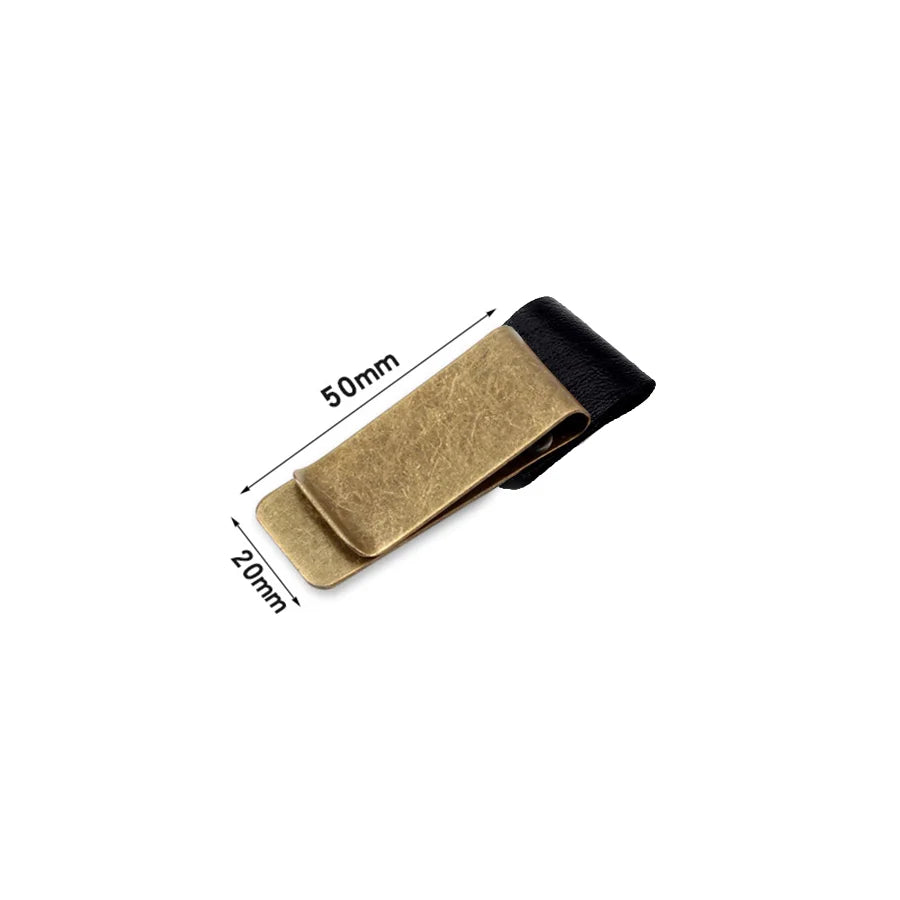 A brass pen holder and journal clip with a black leather strap, shown from above.