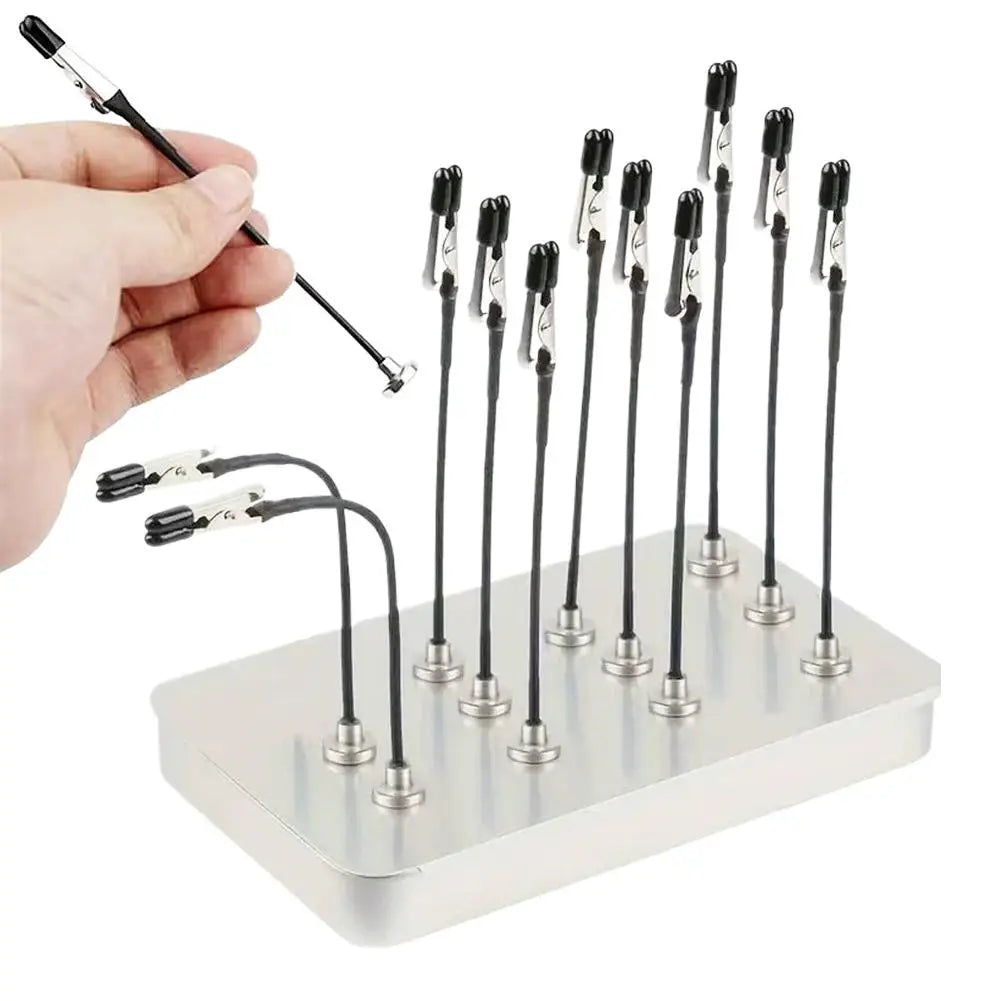 A hand holds a magnetic painting stand with multiple tools for art and craft.