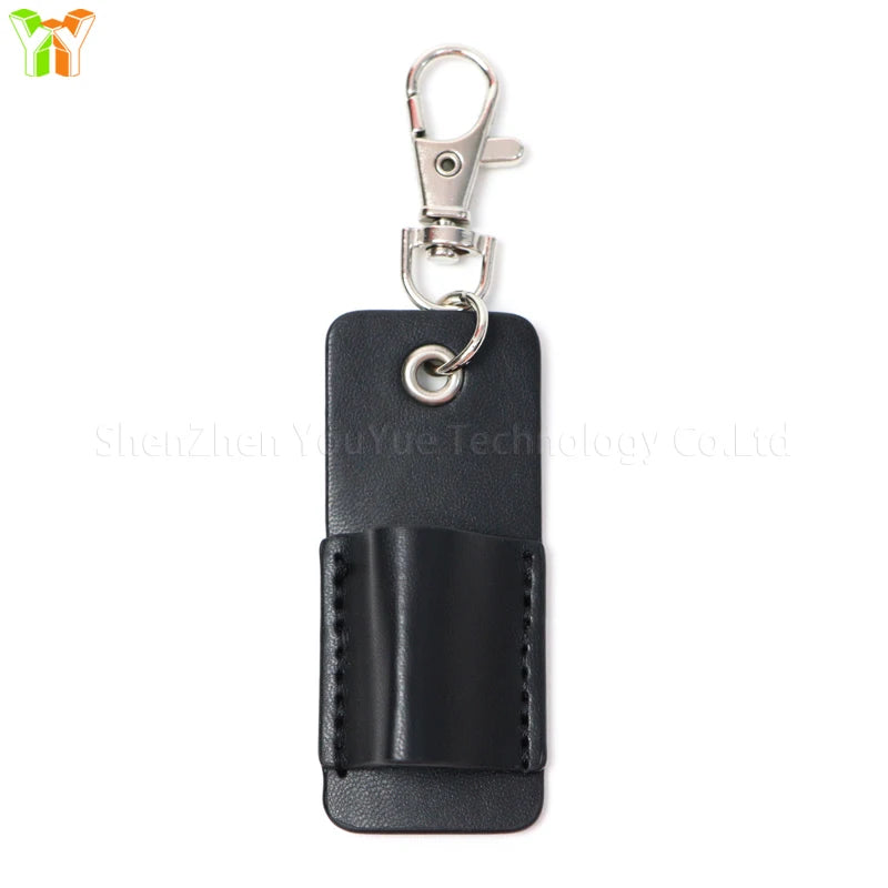 Black leather pen holder keychain with silver clasp and keyring.