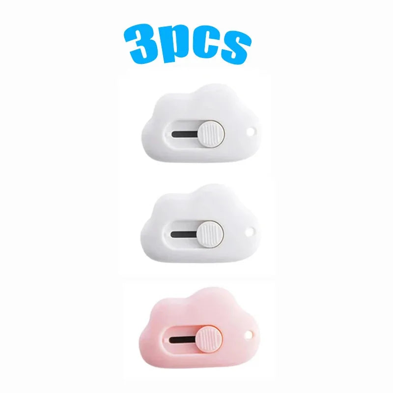 Three utility knives in white and pink colors are shown, packaged as a 3-piece set.