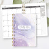 A purple marble monthly planner for 2026-2028 with gold spiral binding and gold accents.