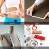 A collection of tools including a measuring tape, fabric, and sewing items used for tailoring and crafts.