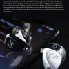 A pair of silver KZ Castor earphones resting on a dark smartphone screen.