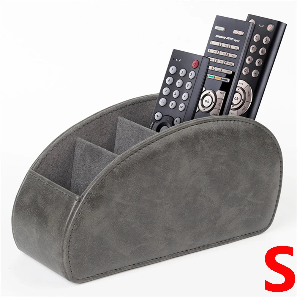 A grey PU leather remote control holder with five compartments displaying various electronic devices.