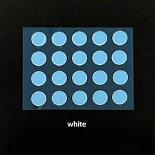 A grid of light blue adhesive dots on a clear plastic surface for PTFE mouse skates.