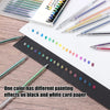 A collection of glitter gel pens in various colors laid out on white paper and a black ruler.