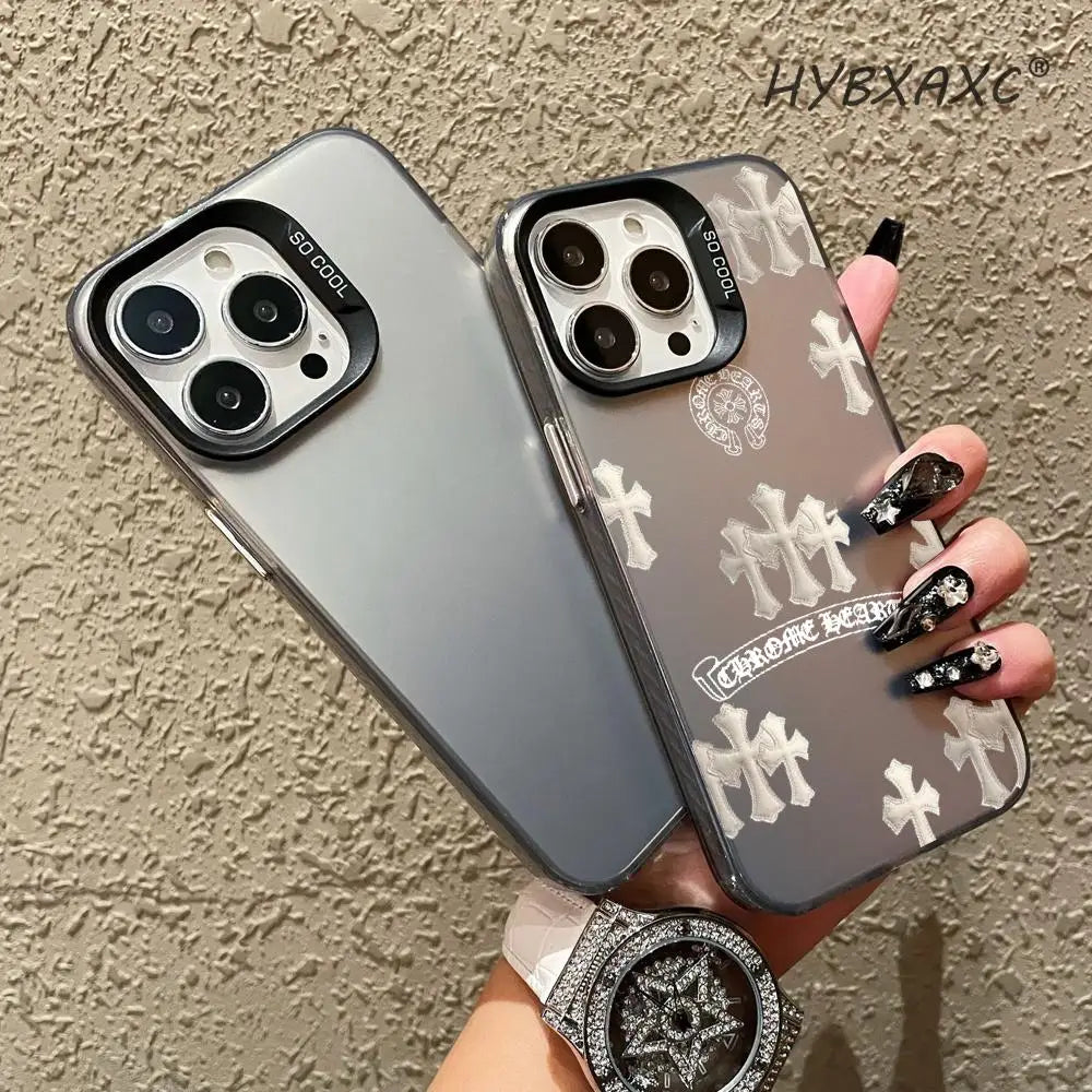 A hand holds a holographic gradient phone case for an iPhone against a textured wall.