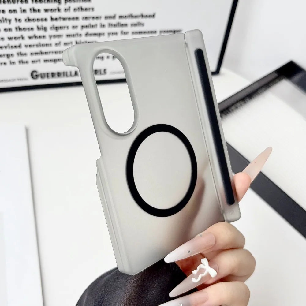 A hand holds a silver Samsung Galaxy Z Fold case with a magnetic hinge protection feature.
