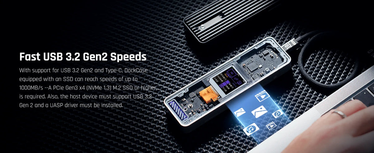 A high-speed NVMe SSD enclosure with an LCD display is shown on a dark surface.