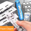 A hand is using a clear plastic paper clipper to clip documents, with other similar clippers visible in the background.