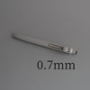 A close-up view of a silver precision gel pen with a 0.7mm tip resting on a gray surface.
