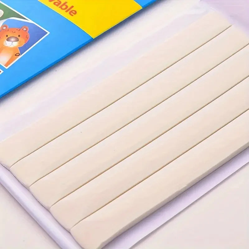 A pack of white reusable wall-safe sticky adhesive putty sticks arranged diagonally on a white surface.