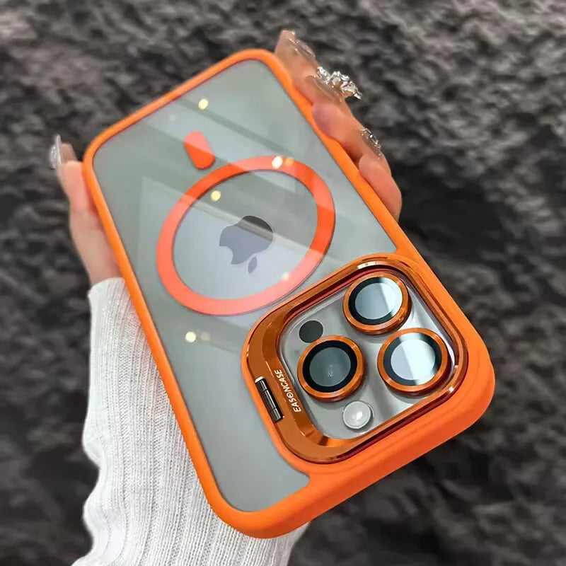 An orange magnetic shockproof phone case for an iPhone is held in a person's hand.