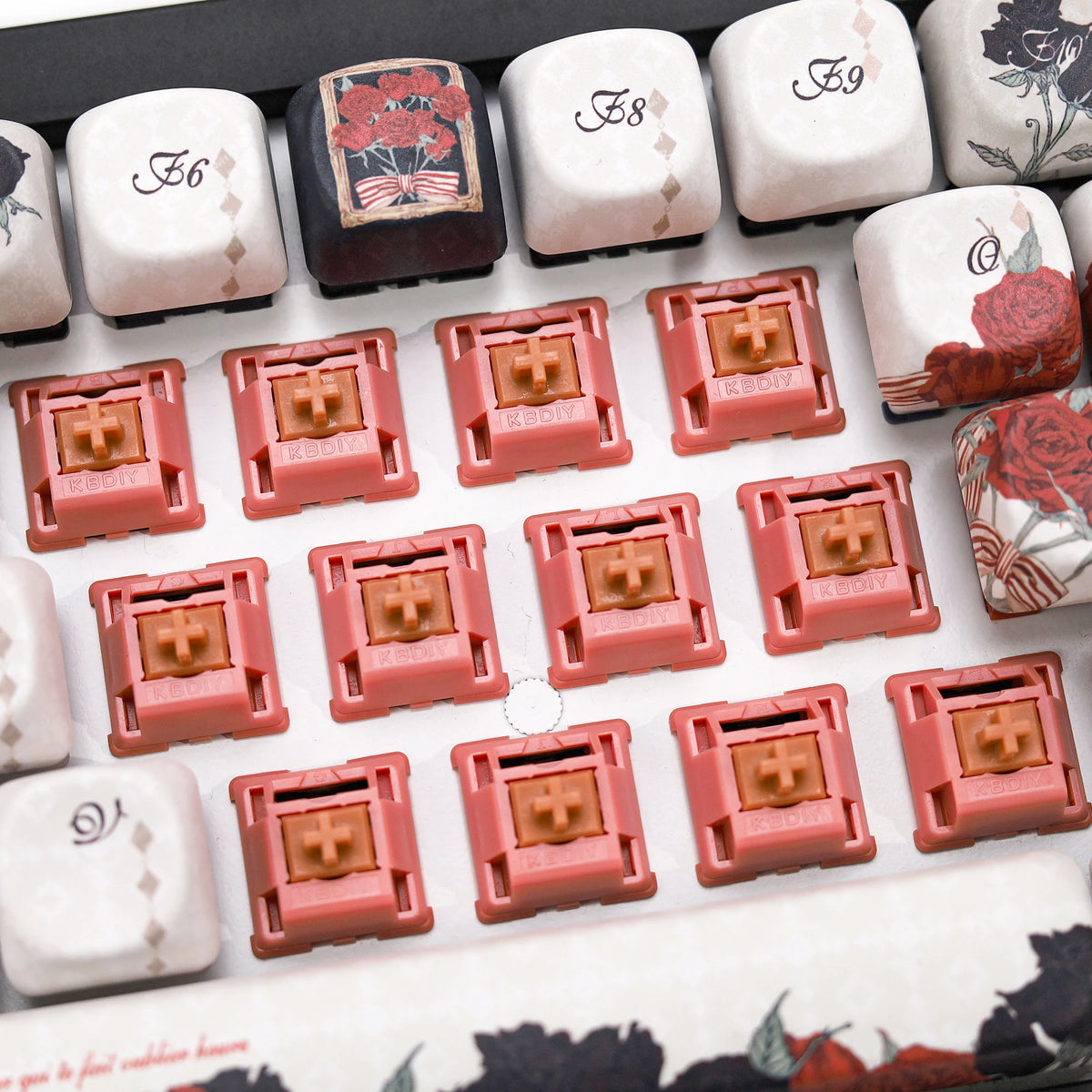 A close-up view of Rosewood Linear Mechanical Keyboard Switches in various colors and shapes.