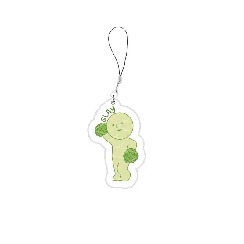 A clear acrylic charm shaped like a green, round-faced character is attached to a silver keychain.