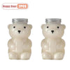 Two white bear-shaped reusable water bottles with silver lids