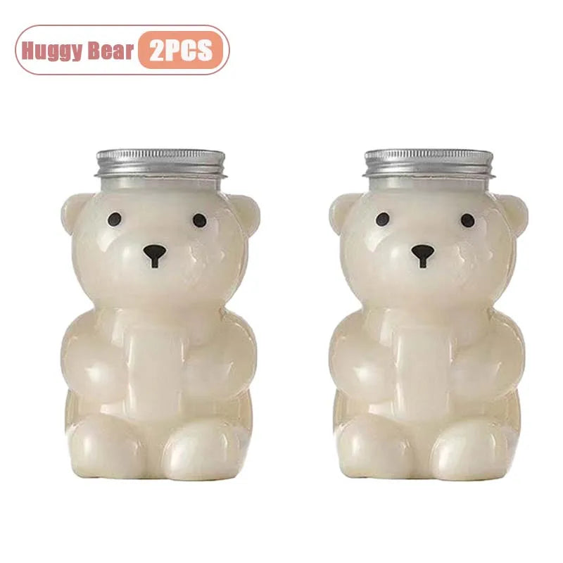 Two white bear-shaped reusable water bottles with silver lids