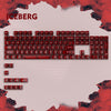 A close-up view of a mechanical keyboard with red keycaps and the word ICEBERG visible above it.