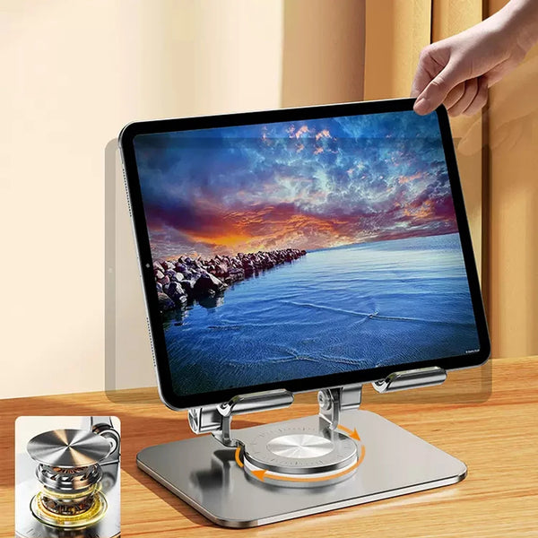 A hand places a tablet onto a 360° rotating stand for viewing.