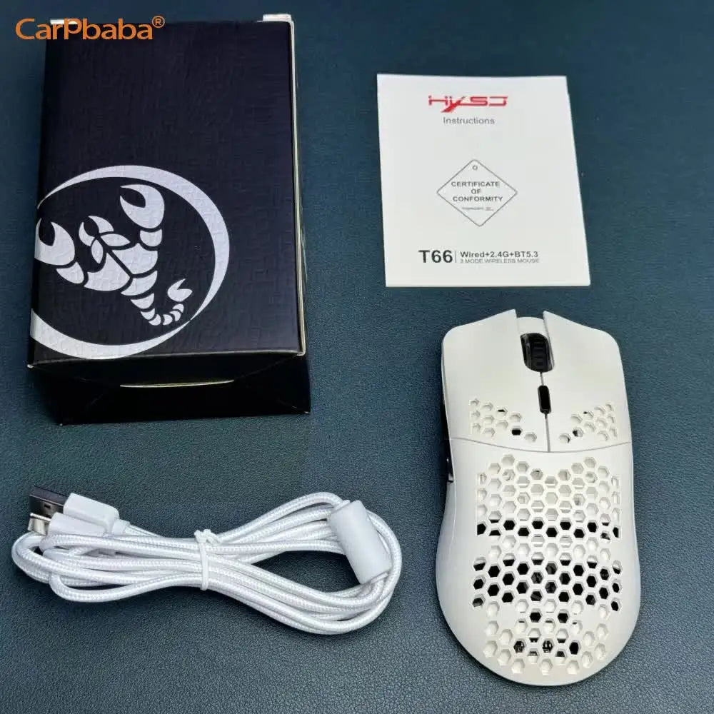 A black box, instructions, and a white wireless gaming mouse with RGB lighting are displayed on a dark surface.