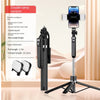 A black 360 degree rotation selfie stick with a smartphone mounted on top and a detachable grip is shown against a light back
