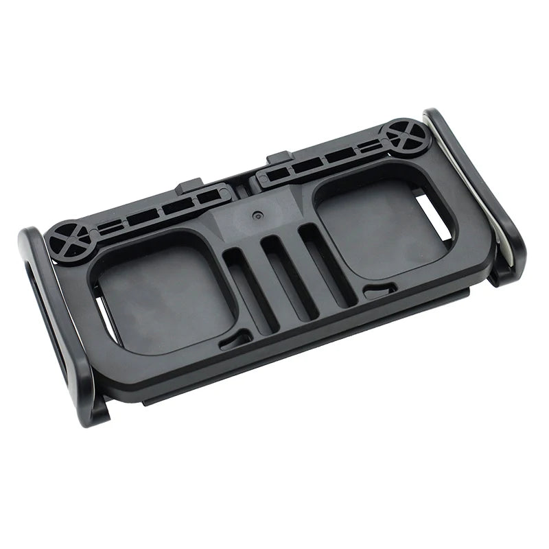 Soporte de clip negro para control remoto de dron DJI, diseñado para montarse en tableta o teléfono.