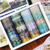 A set of oil painting themed decorative washi tape rolls in a white box, featuring various landscape and abstract colors.