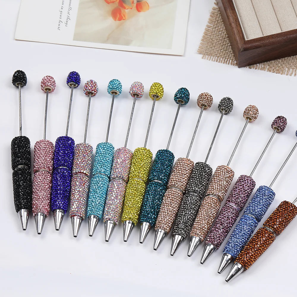 A set of 20 rhinestone beaded pen accessories in various colors and finishes.