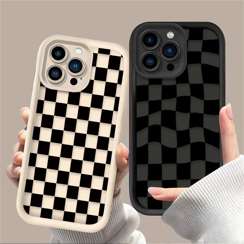 A hand holds a black and white checkered silicone phone case on a smartphone.
