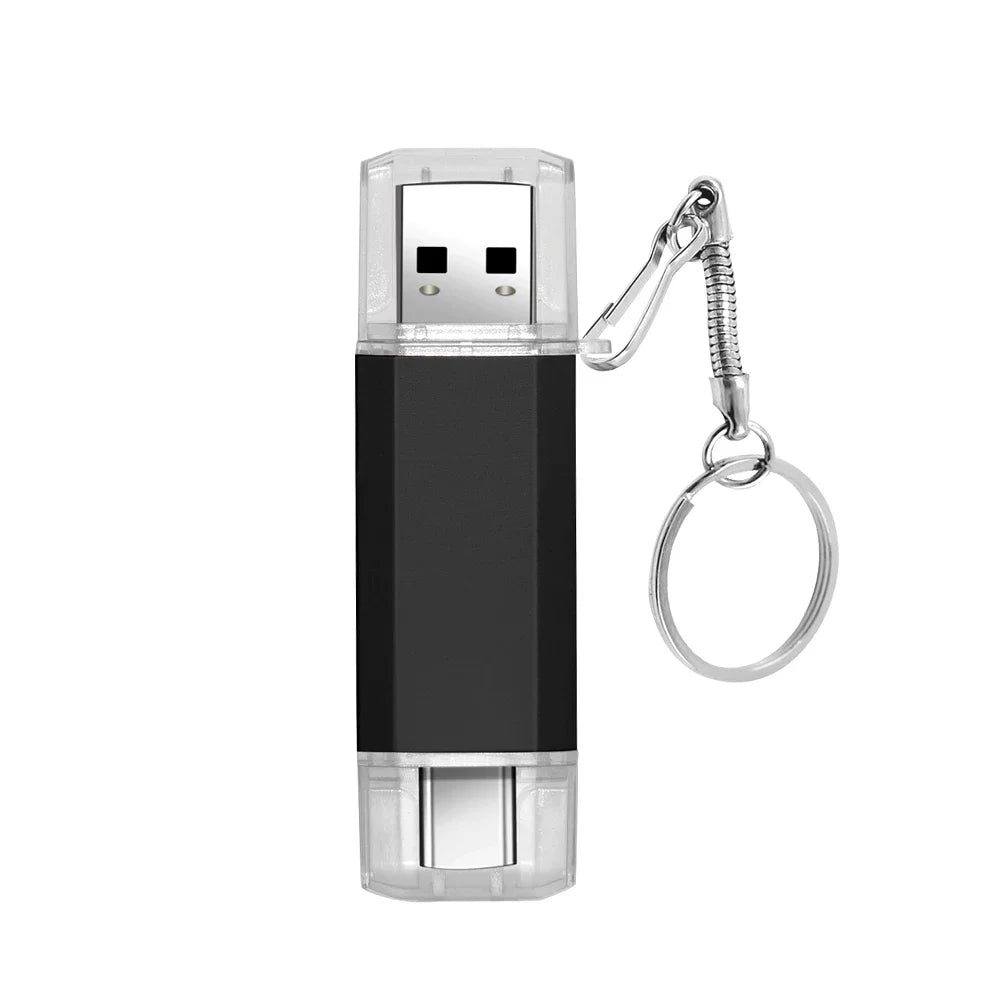 A black dual USB and Type-C flash drive with a clear plastic casing and a metal keyring attachment.