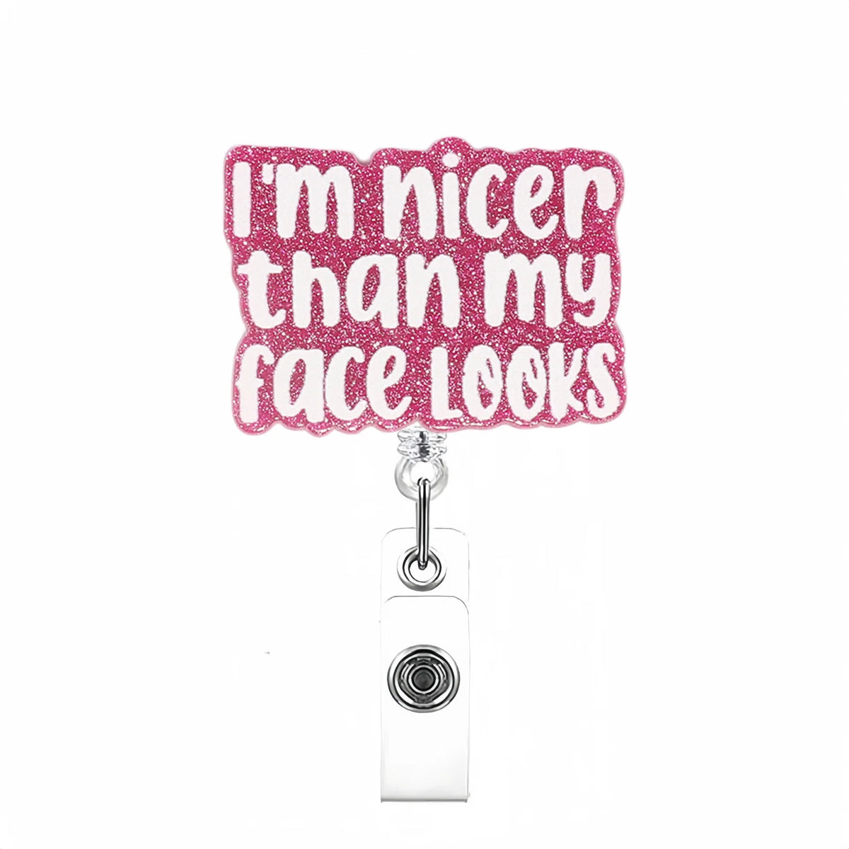 Rosa Glitzer-Text-Badge mit der Aufschrift „Ich bin nett/freundlicher als mein Gesicht aussieht“ an einem ausziehbaren Auswei