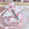 An intricate art knife cutter featuring cat claw and angel wing designs in pink and white.