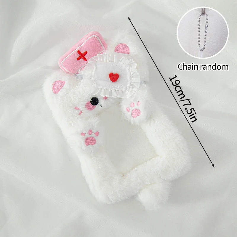 White plush cat-shaped photocard holder with pink accents and a chain.
