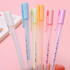 A collection of colorful blue and pink precision quick-dry spot glue pens standing upright.