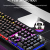 Close-up of a low profile wired gaming keyboard showing mechanical suspension keycaps and purple LED lighting.
