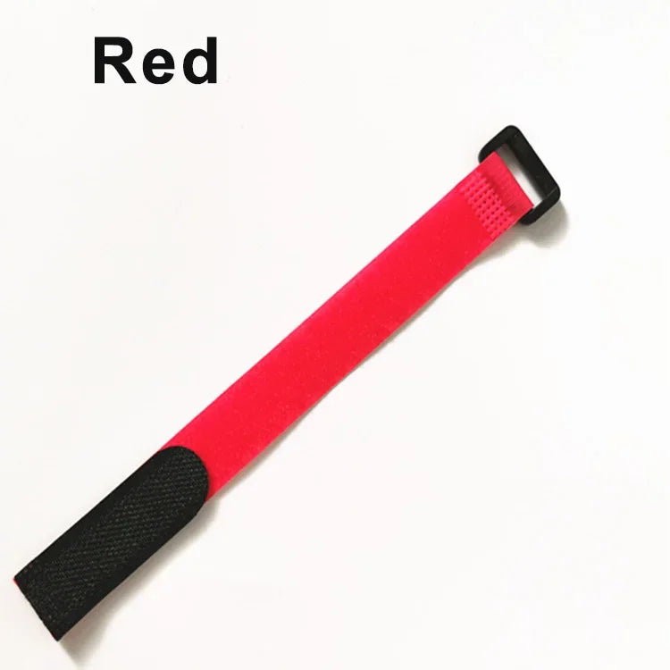 A red hook and loop cable tie with a black grip and buckle.