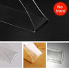 Close-up view of heavy-duty nano double-sided adhesive tape showing its clear, flexible nature on various surfaces.