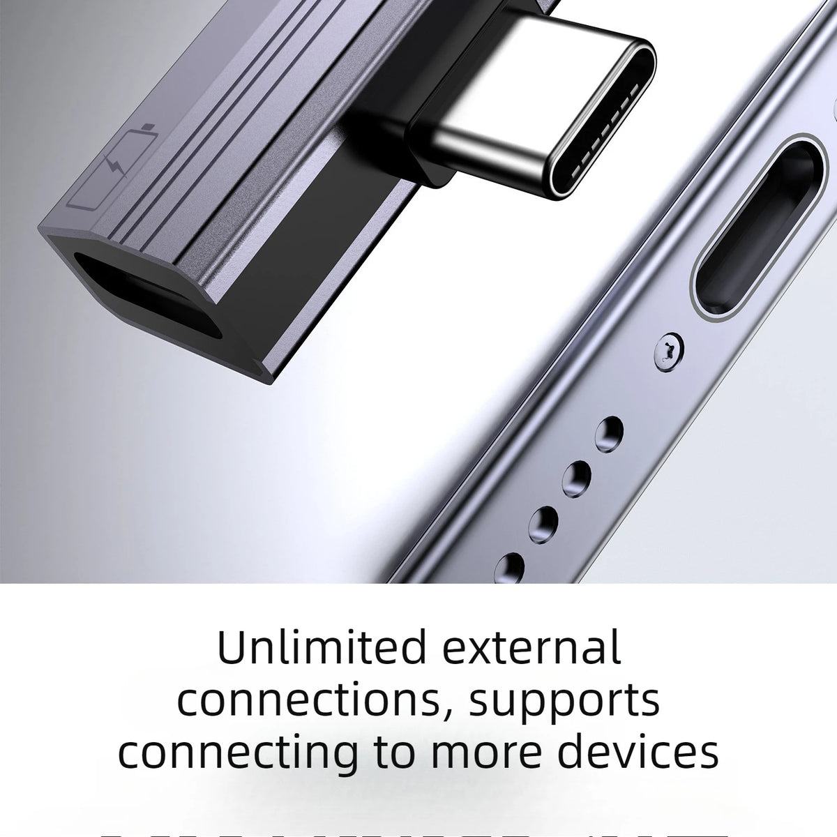 Close-up view of a silver USB-C to 3.5mm audio adapter connector on a device.