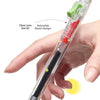 A hand holds a clear pen with an adorable floral design and a low-gravity spring mechanism.