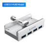 A silver multi-port USB 3.0 hub with a clip, featuring four ports.