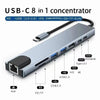 A silver USB-C 8 in 1 concentrator hub with multiple ports including HDMI, USB, and SD/TF.