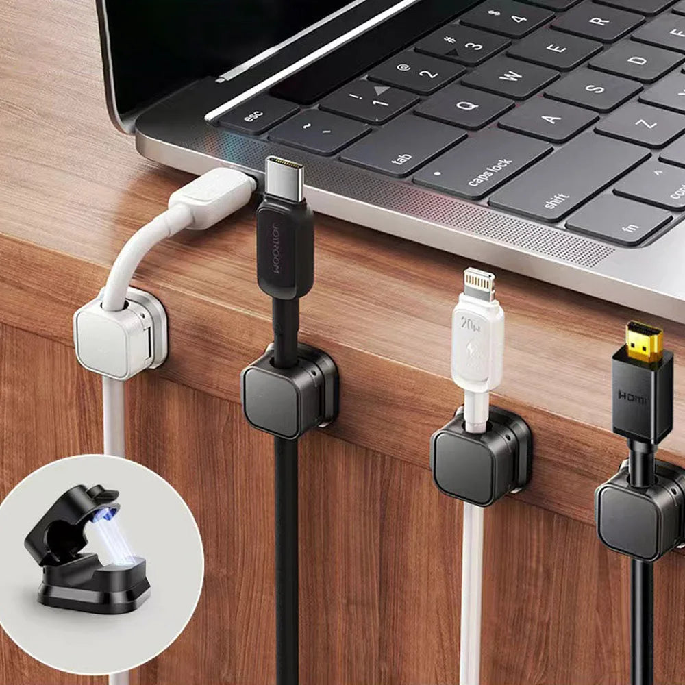 A set of magnetic cable clips attached to a laptop, showing various connectors and a clip for securing cables.