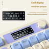 A close-up view of a purple and white multifunctional keyboard with an RGB display showing system information.